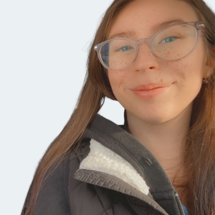 a cat sitting in grass